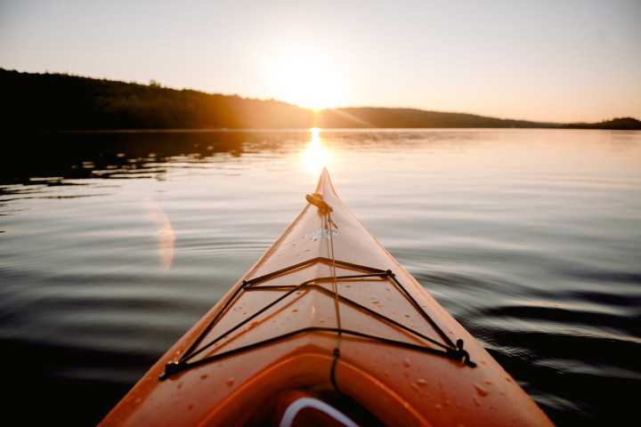 a close up of a boat next to a body of water